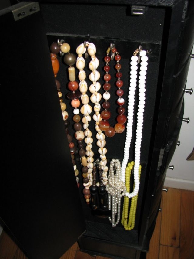 long beaded necklaces in the side compartment of my jewelry armoire