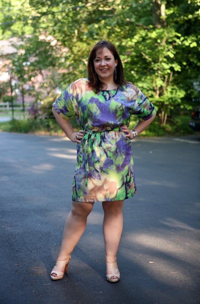 Alison Gary of Wardrobe Oxygen in a watercolor print silk dress with beige sandals from Sofft
