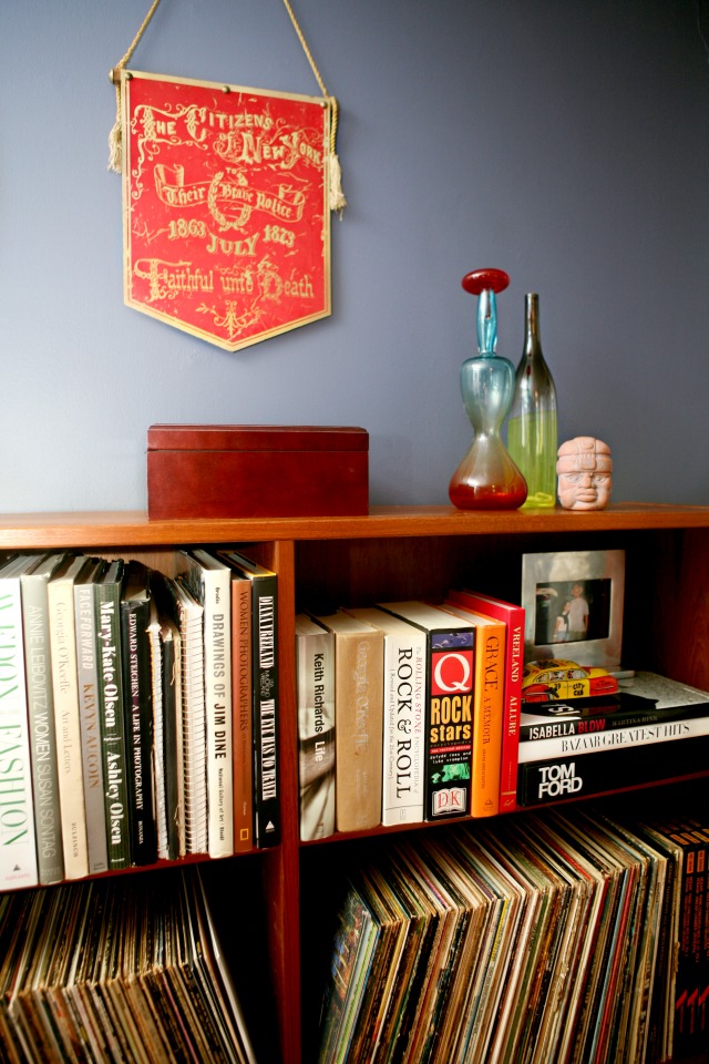 Details of a bookcase full of art and music books and vinyl records in th3e home office of Alison Gary of Wardrobe Oxygen