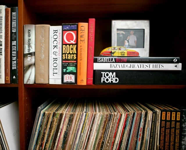 books about music and fashion in a Scandinavian mid century modern bookcase