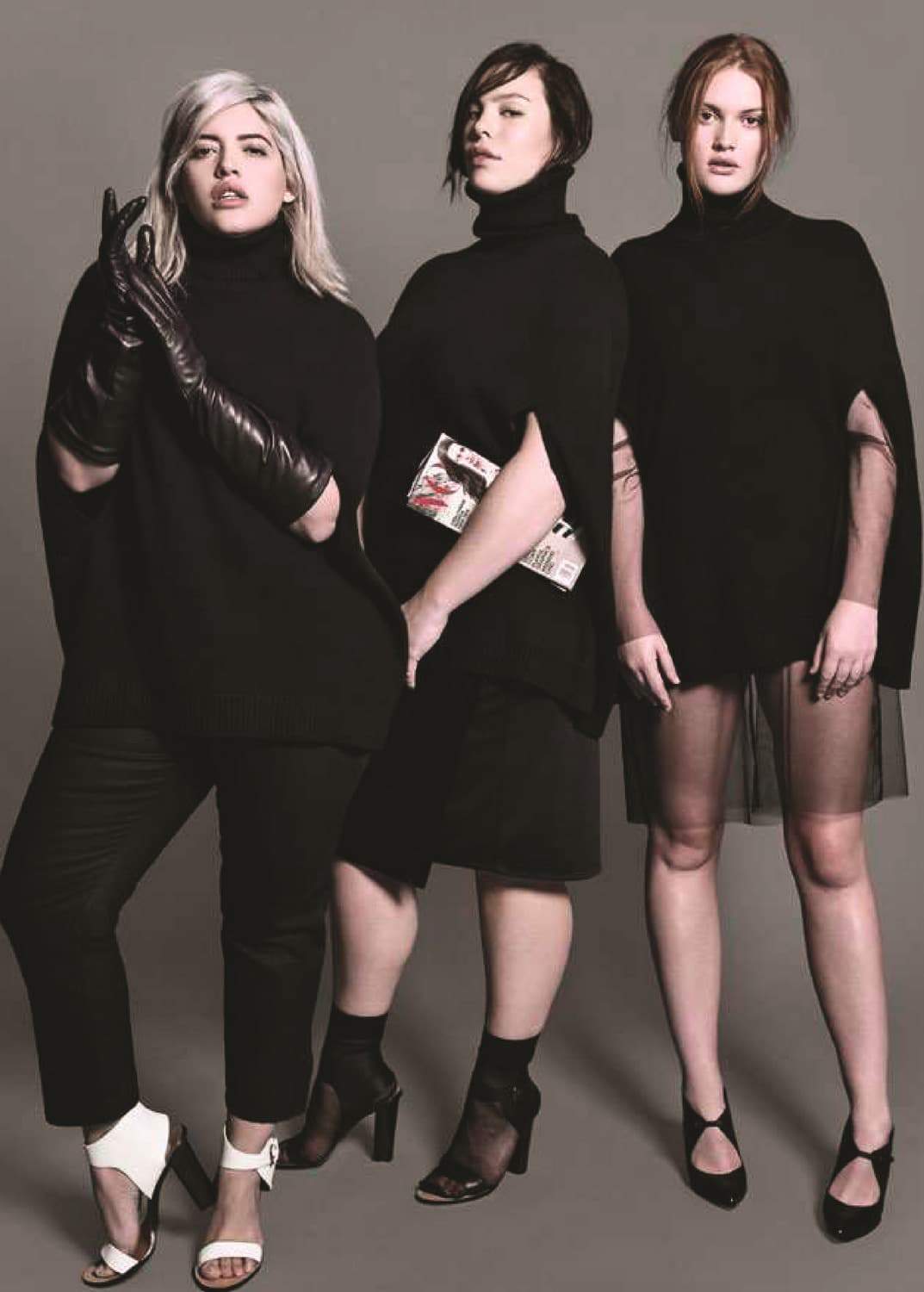 a 2019 press photo from Universal Standard showing three plus size models in edgy architectural fashion in the color black