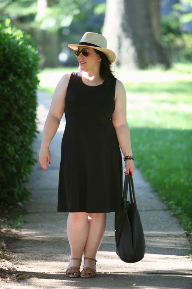 Alison Gary of Wardrobe Oxygen in a Christopher & Banks black ponte not-so-little black dress styled for a winery with a straw hat, sandals, and a leather tote