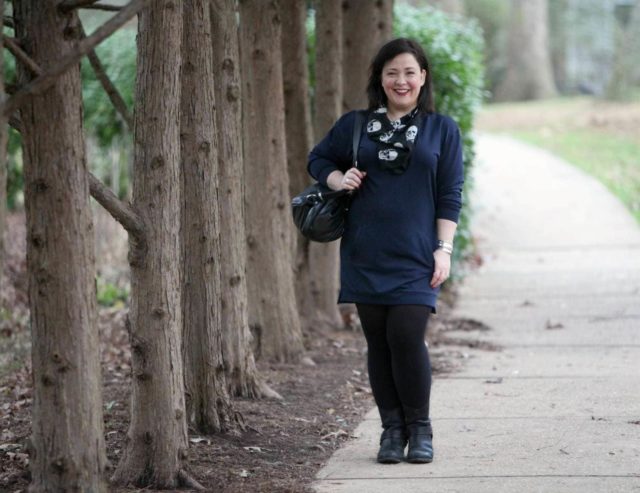 Wardrobe Oxygen, an over 40 fashion and personal style blog, featuring a navy sweatshirt dress and black harness boots