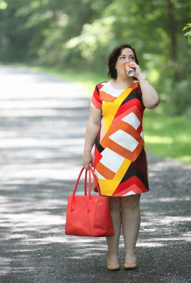 Wardrobe Oxygen in a Vince Camuto Dress and carrying a Dagfne Dover 15 inch tote