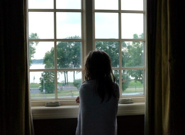 Emerson at the window of Little River Inn Memphis