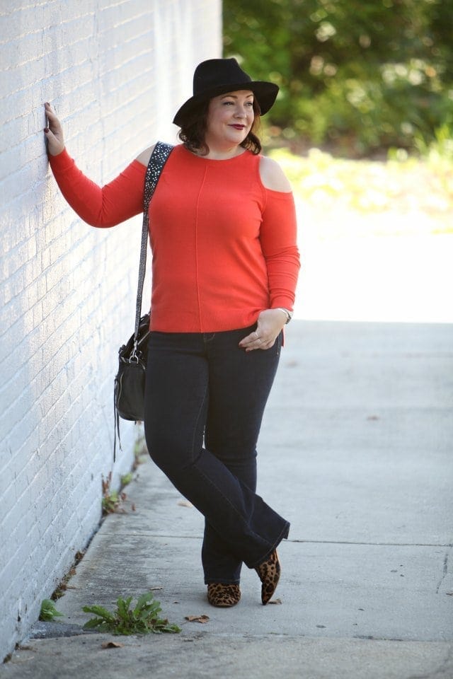 Wardrobe Oxygen, over 40 fashion blogger in JAG Jeans, Nine West leopard calfhair booties, and a Rebeccaa Minkoff moto bag with guitar strap