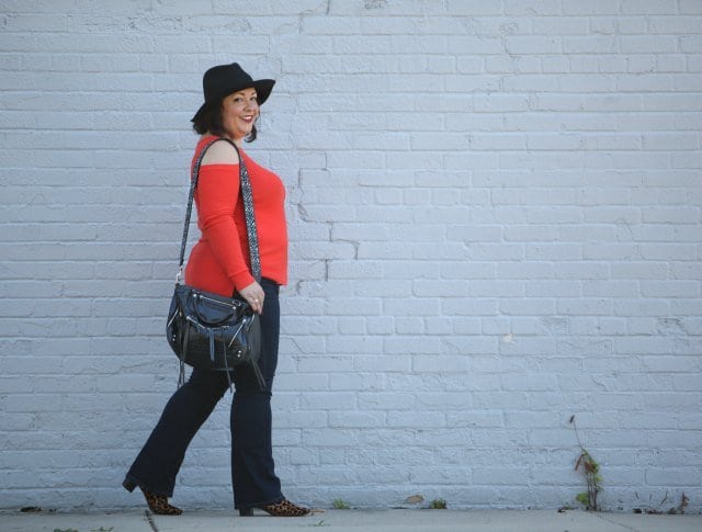 Wardrobe Oxygen, over 40 fashion blogger in JAG Jeans, Nine West leopard calfhair booties, and a Rebeccaa Minkoff moto bag with guitar strap