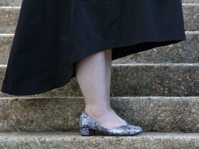 Wardrobe Oxygen in a vintage fur capelet, CityChic high-low evening dress and glitter pumps from J. Renee