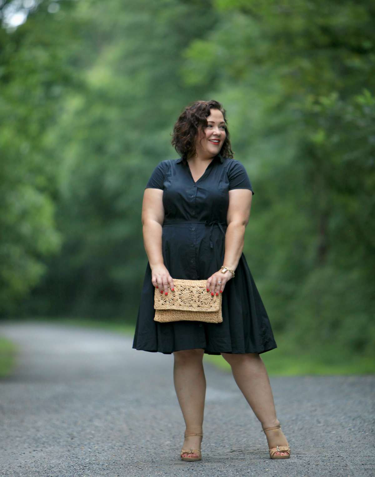Wardrobe Oxygen in a black cotton shirt dress from ellos with Aerosoles wedge sandals and a raffia clutch bag