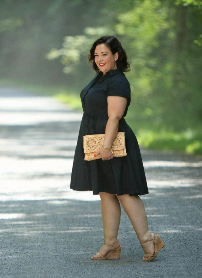 Wardrobe Oxygen in a black cotton shirt dress from ellos with Aerosoles wedge sandals and a raffia clutch bag