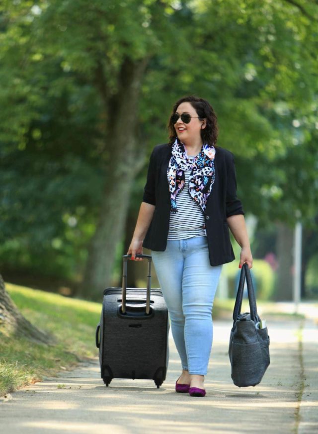 Wardrobe Oxygen dressed for travel in a cabi scarf, JAG Jeans and Ricardo Beverly Hills luggage
