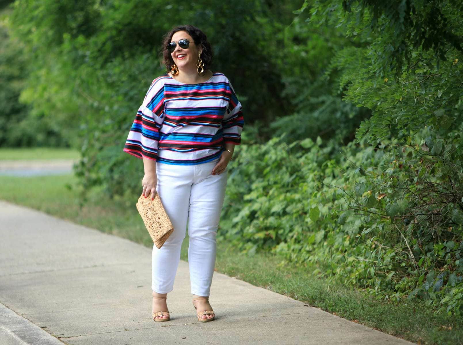 Wardrobe Oxygen in a candy striped cotton bell sleeve blouse from Vince Camuto with white Talbots ankle jeans, Aerosoles sandals, and a raffia clutch