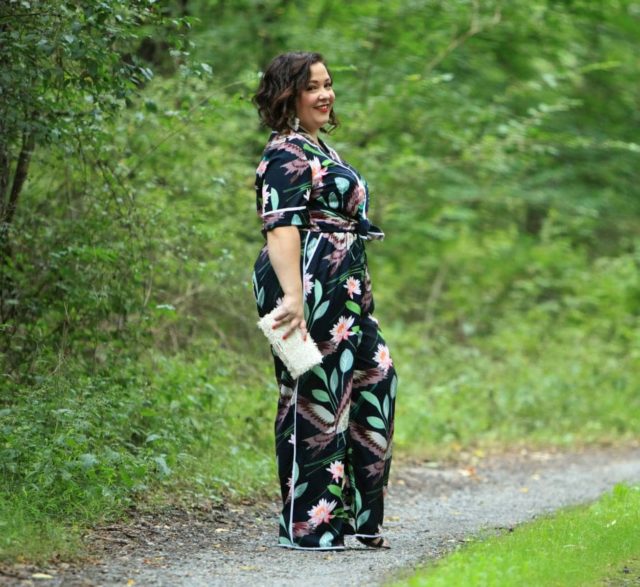 Wardrobe Oxygen in daytime pajamas in a navy botanical print by ELOQUII styled with J. Crew earrings and a Loeffler Randall fringe clutch