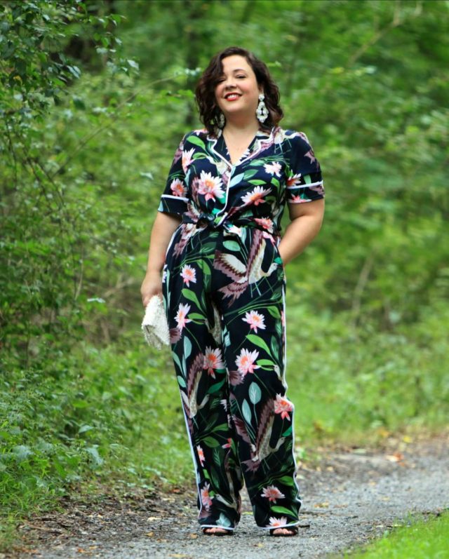 Wardrobe Oxygen in daytime pajamas in a navy botanical print by ELOQUII styled with J. Crew earrings and a Loeffler Randall fringe clutch