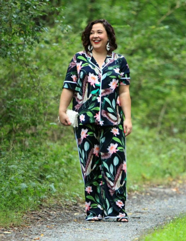 Wardrobe Oxygen in daytime pajamas in a navy botanical print by ELOQUII styled with J. Crew earrings and a Loeffler Randall fringe clutch