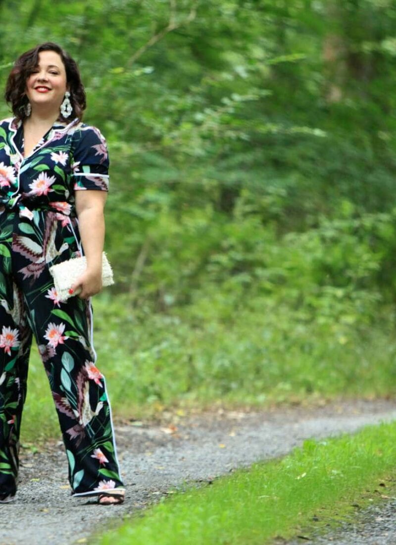 Wardrobe Oxygen in daytime pajamas in a navy botanical print by ELOQUII styled with J. Crew earrings and a Loeffler Randall fringe clutch