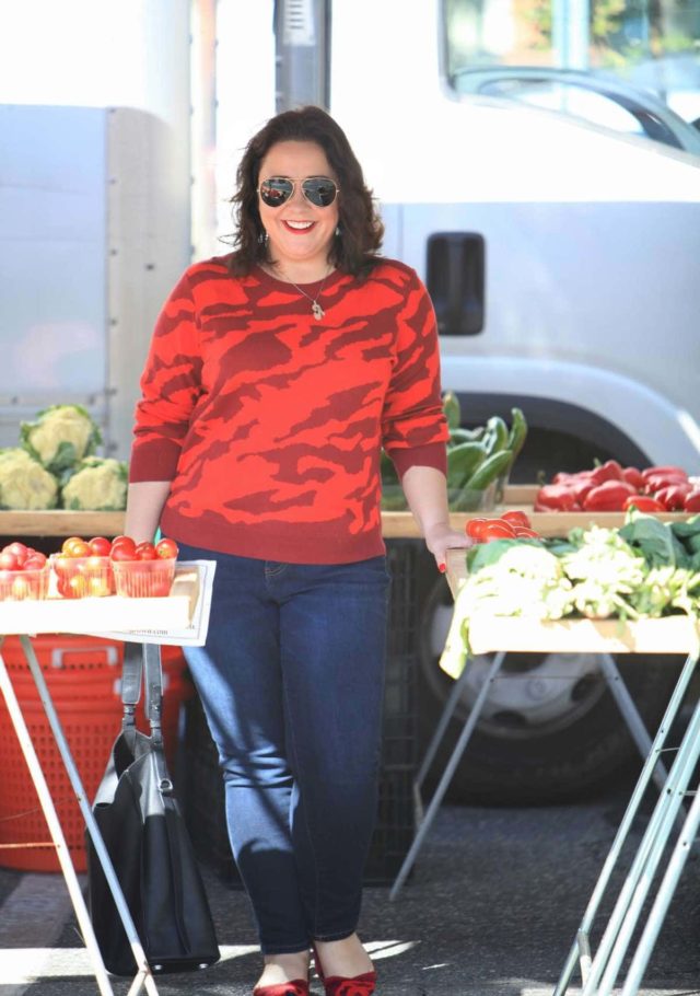 Wardrobe Oxygen in a red camo print sweater with JAG Jeans and Rothy's Flats