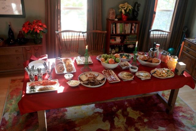 display of brunch food on a red tablecloth