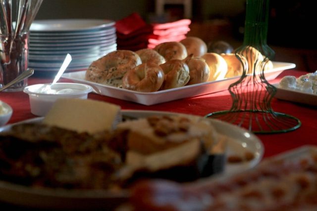 display of brunch food on a red tablecloth