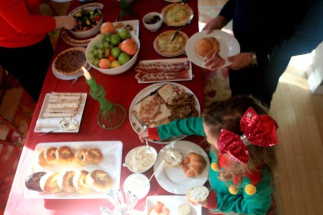 display of brunch food on a red tablecloth