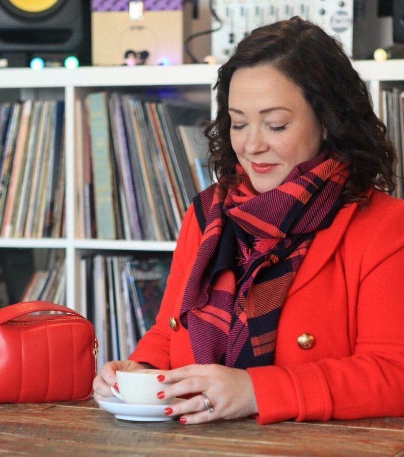 Wardrobe Oxygen in a red Talbots peacoat, plaid scarf, and purple leather gloves with Talbots Flawless Fit bootcut jeans
