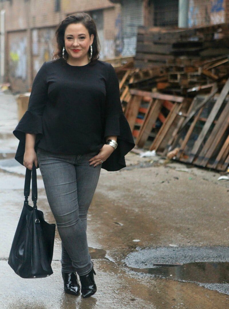 wardrobe oxygen in an eloquii blouse with the allsaints paradise tote