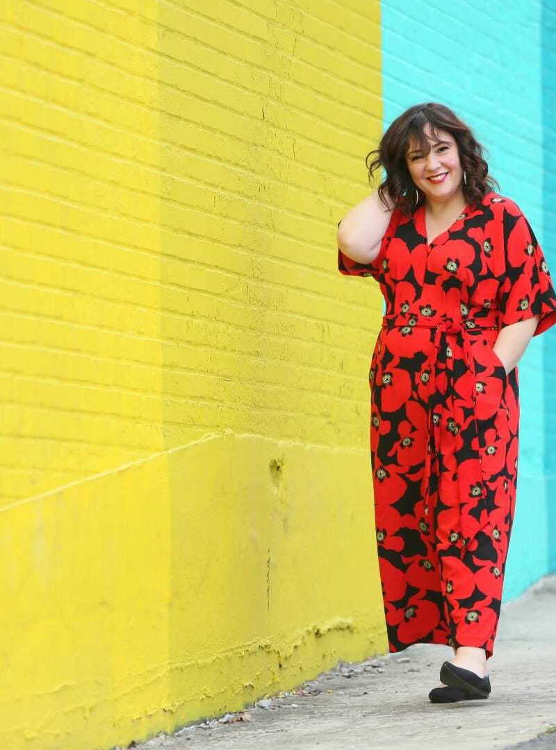 Wardrobe Oxygen in a red floral jumpsuit from ELOQUII with Rothy's flats
