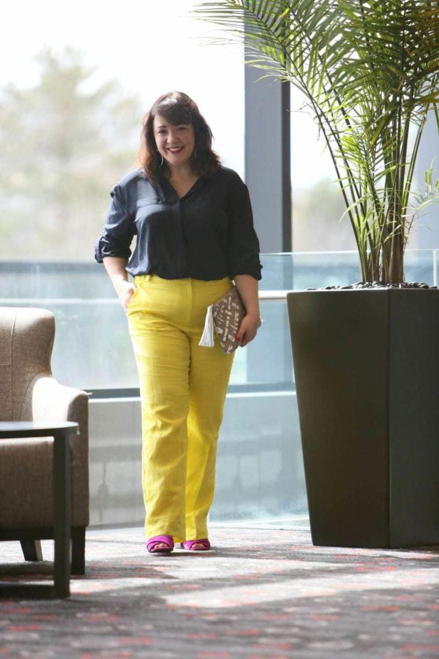 Wardrobe Oxygen in yellow linen pants from Talbots with a navy silk blouse and silver Monserat De Lucca woven clutch