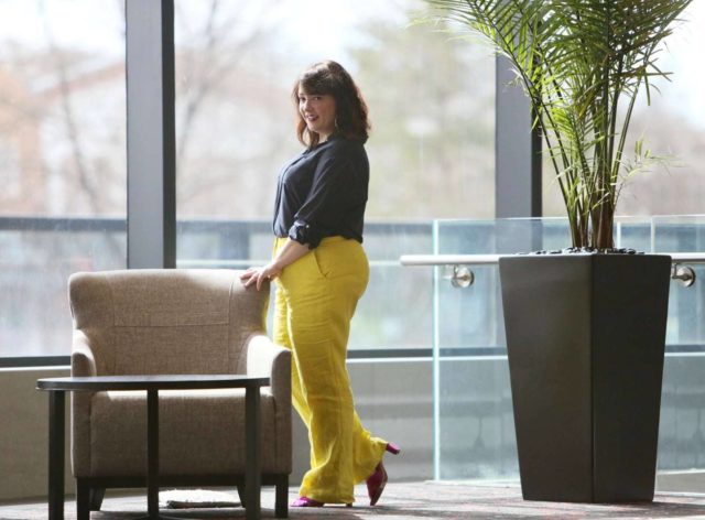 Wardrobe Oxygen in yellow linen pants from Talbots with a navy silk blouse and silver Monserat De Lucca woven clutch