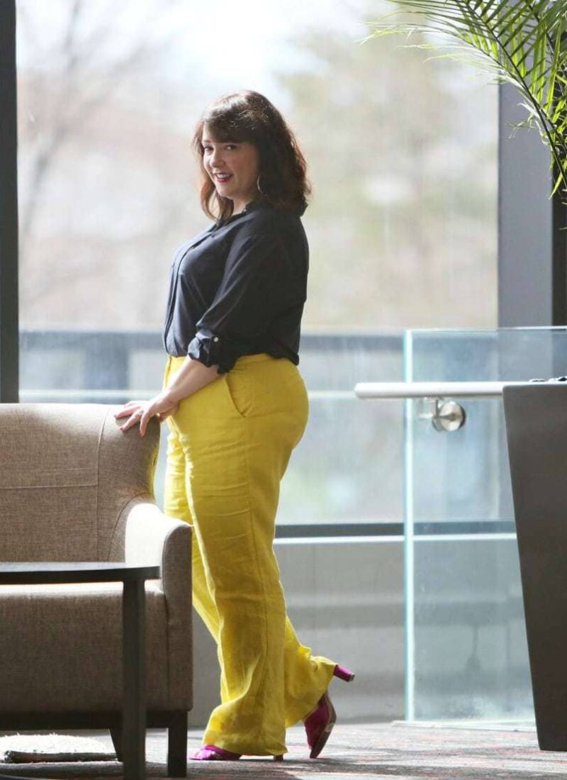 Wardrobe Oxygen in yellow linen pants from Talbots with a navy silk blouse and silver Monserat De Lucca woven clutch