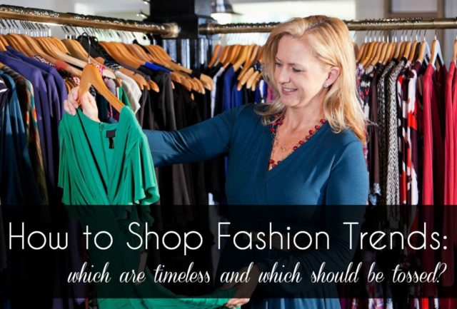Image of a woman in a clothing store, looking at a green dress while smiling. Text overlay that says how to shop for fashion trends, which are timeless and which should be tossed.
