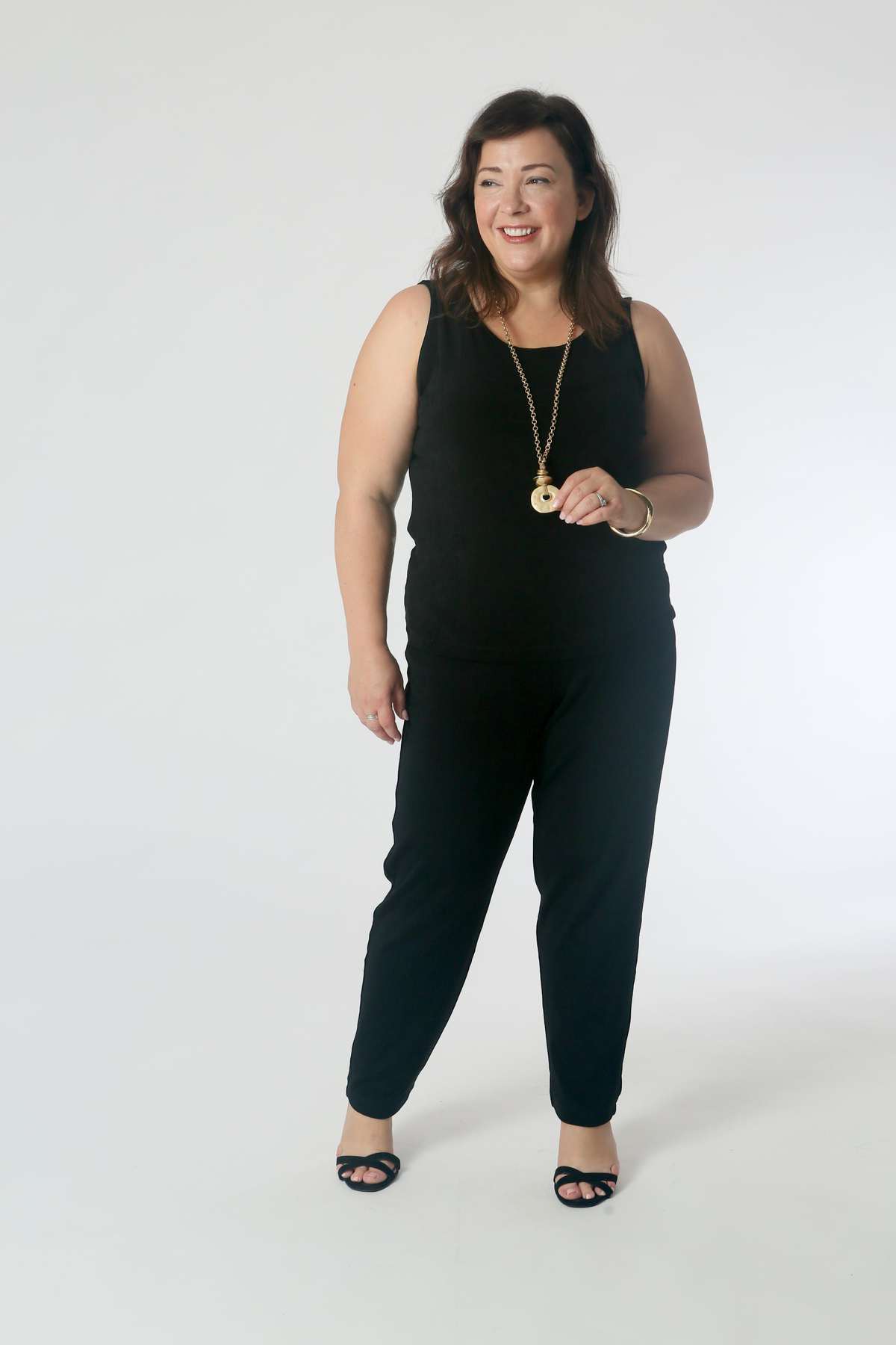 Jumpsuit and Jive: Tuck the tank into the pants for a jumpsuit effect. Add a pendant necklace to elongate the figure.
