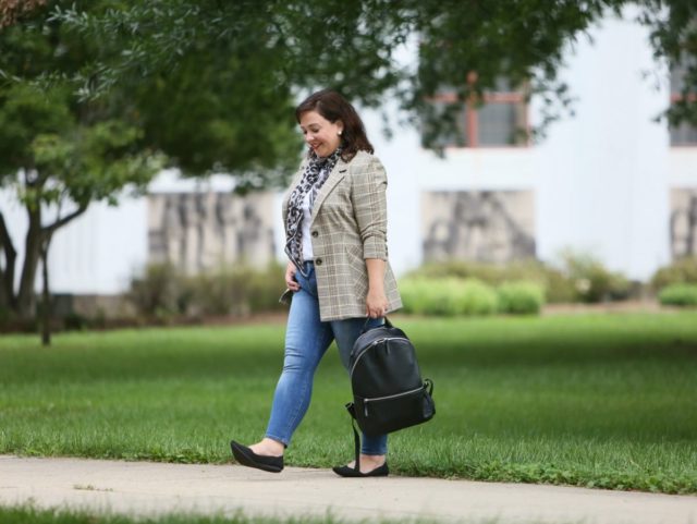 Wardrobe Oxygen in the cabi Pastime jacket and leopard scarf styled with a Universal Standard t-shirt, Banana Republic jeans, Rothy's flats, and the ECCO SP3 backpack for fall