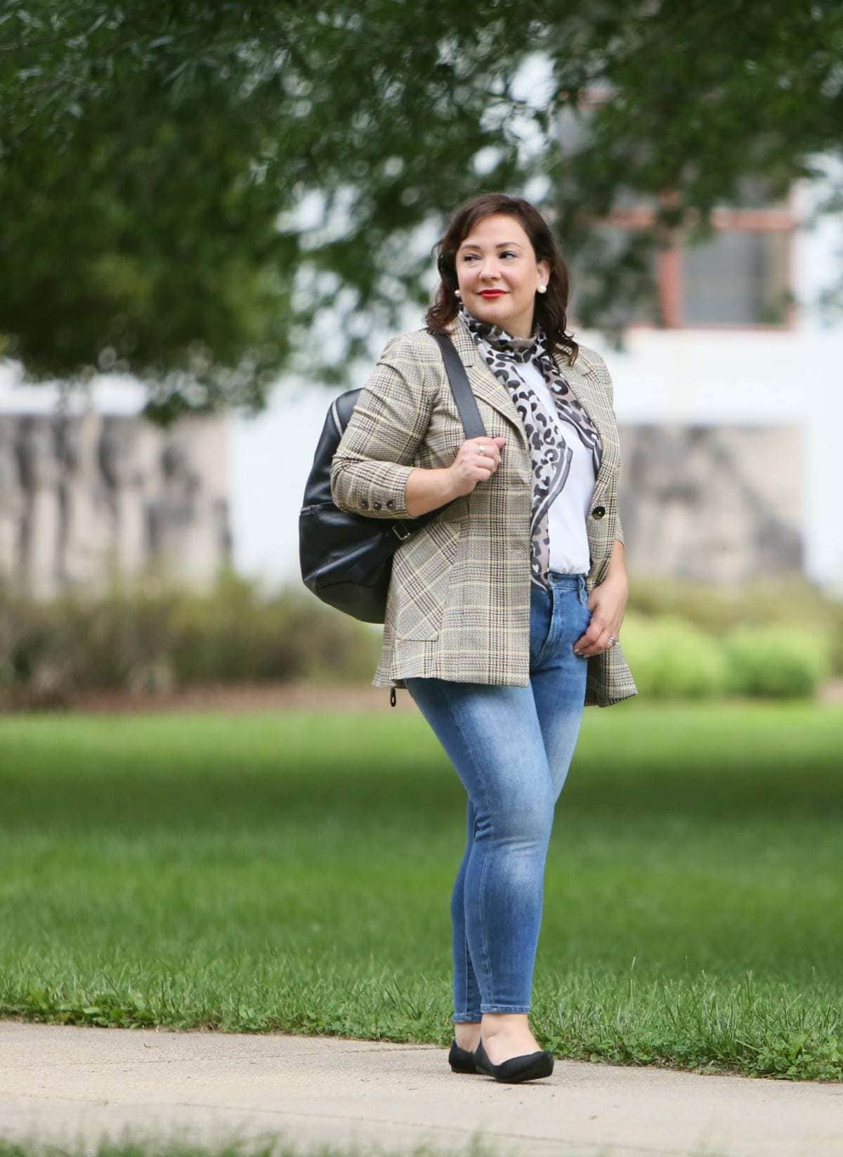 Wardrobe Oxygen in the cabi Pastime jacket and leopard scarf styled with a Universal Standard t-shirt, Banana Republic jeans, Rothy's flats, and the ECCO SP3 backpack for fall