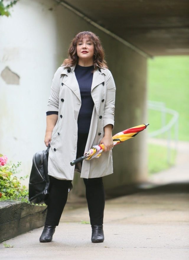 Alison Gary of Wardrobe Oxygen in a Universal Standard Trench Coat with Maryland Flag golf umbrella, navy Talbots cashmere sweater and black Chico's ponte pants