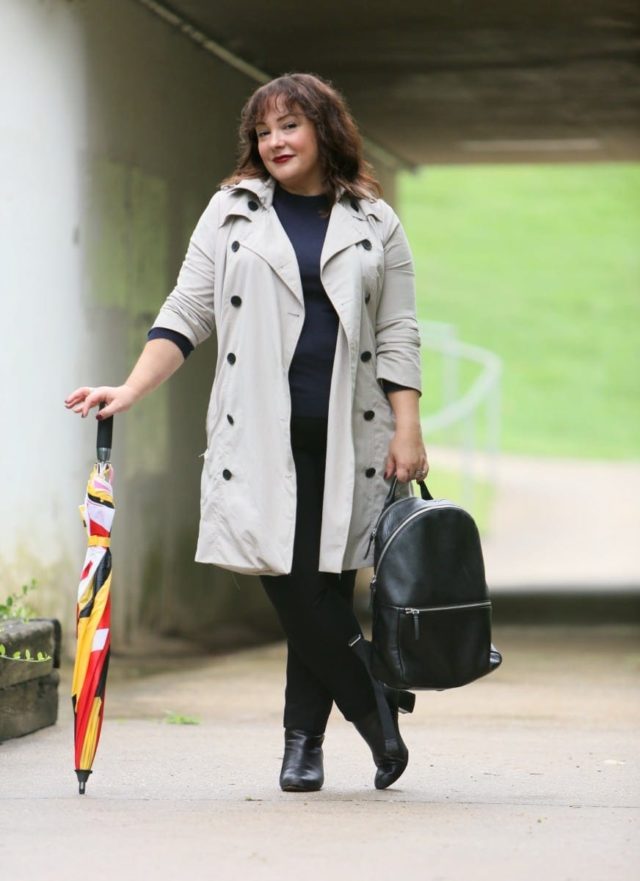 Alison Gary of Wardrobe Oxygen in a Universal Standard Trench Coat with Maryland Flag golf umbrella, navy Talbots cashmere sweater and black Chico's ponte pants