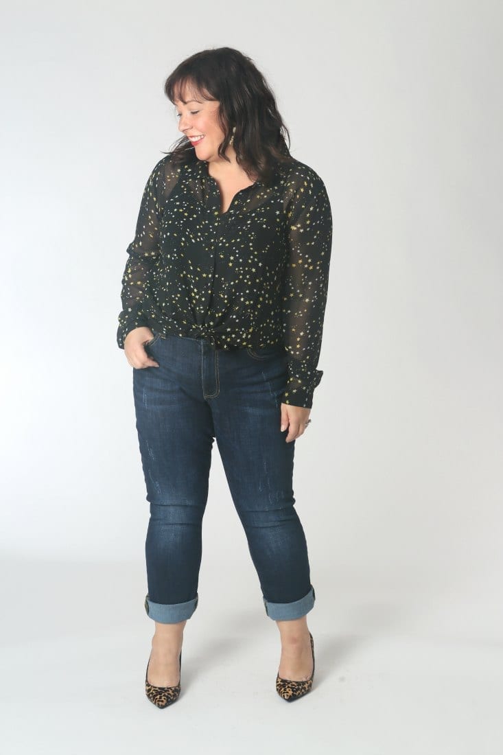 The cabi high straight jeans on a petite woman, hem cuffed