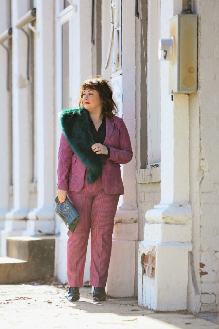 Wardrobe Oxygen in a pink plaid pantsuit from 1901 with a green faux fur stole and green Clare V. folder clutch 