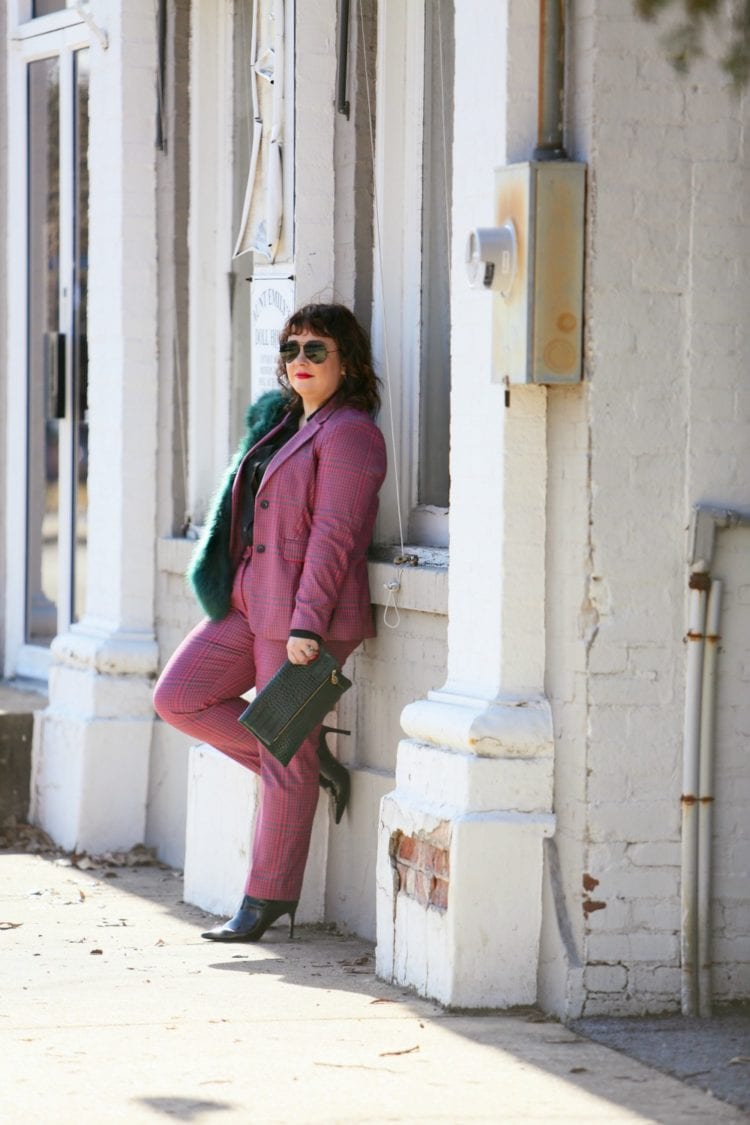 Wardrobe Oxygen in a pink plaid pantsuit from 1901 with a green faux fur stole and green Clare V. folder clutch 