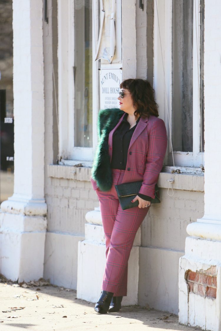 Wardrobe Oxygen in a pink plaid pantsuit from 1901 with a green faux fur stole and green Clare V. folder clutch 