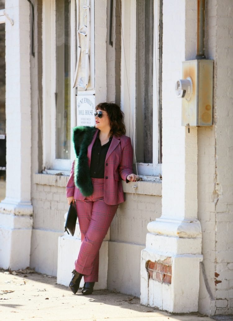 Wardrobe Oxygen in a pink plaid pantsuit from 1901 with a green faux fur stole and green Clare V. folder clutch 