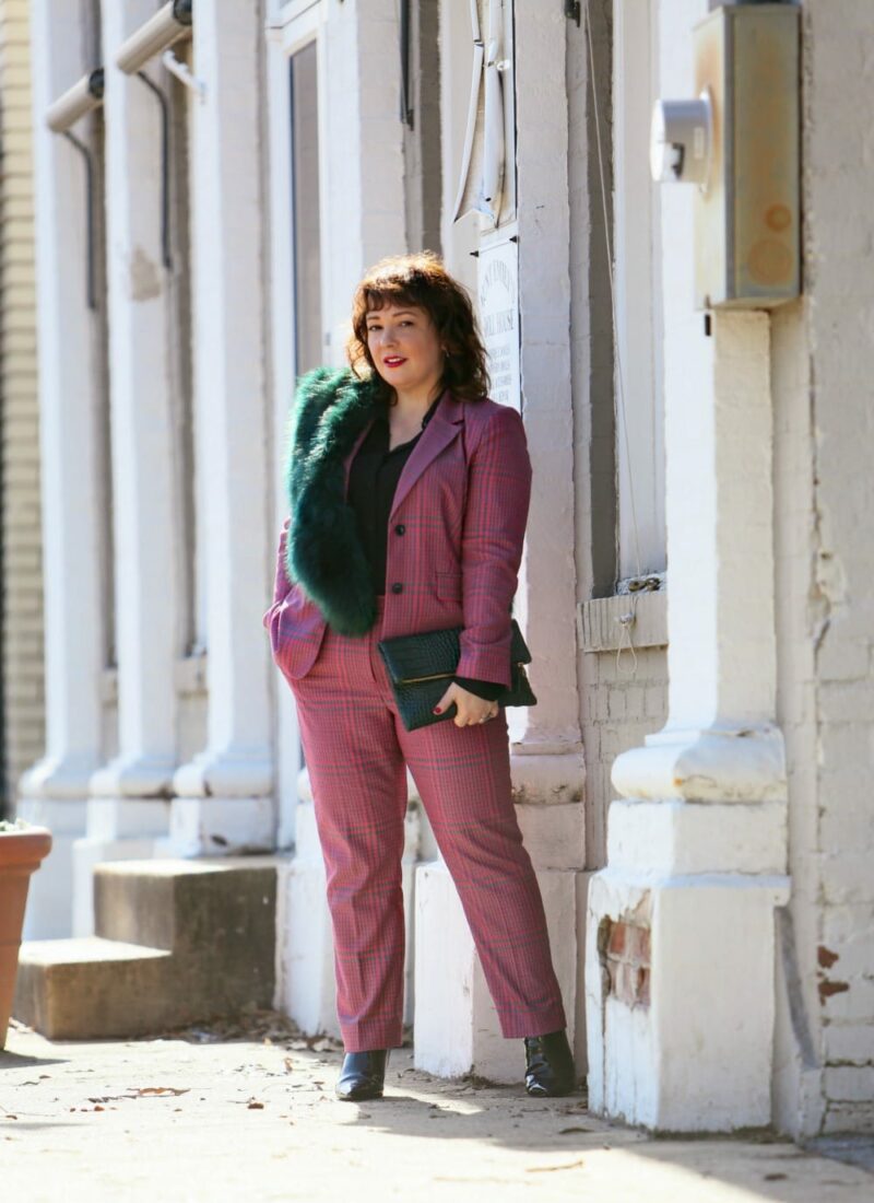 Wardrobe Oxygen in a pink plaid pantsuit from 1901 with a green faux fur stole and green Clare V. folder clutch