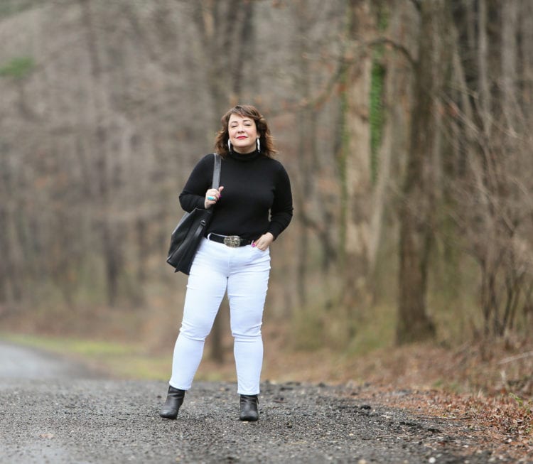 Black Coolmax turtleneck and white stain resistant jeans from Chico's styled on Wardrobe Oxygen with black Clarks ankle boots and the ALLSAINTS North/South totez