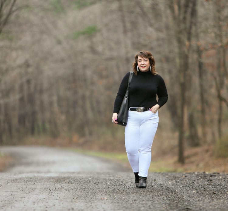 Black Coolmax turtleneck and white stain resistant jeans from Chico's styled on Wardrobe Oxygen with black Clarks ankle boots and the ALLSAINTS North/South tote