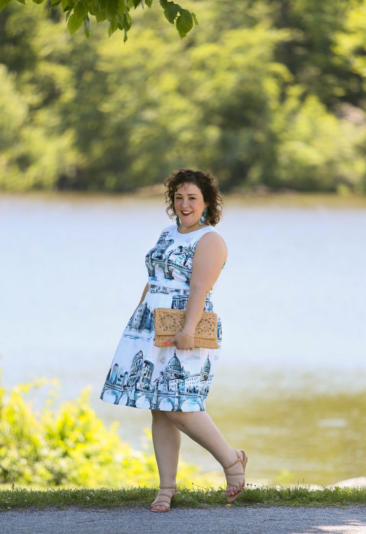 Rome-inspired printed fit and flare dress from Talbots styled with a woven straw clutch purse, Zara earrings, and Talbots wide width wedge sandals