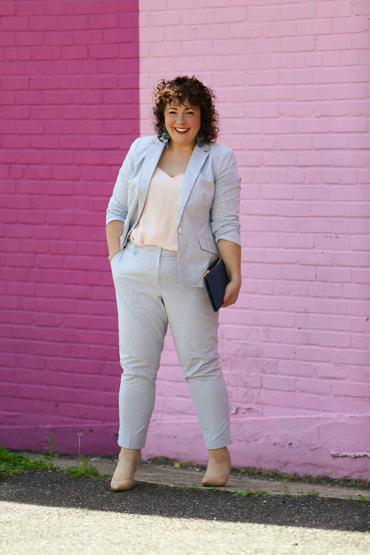 Wardrobe Oxygen in a seersucker pantsuit with blush J. Crew camisole, nude pumps from Nine West, and the Dagne Dover Essentials Clutch Wallet