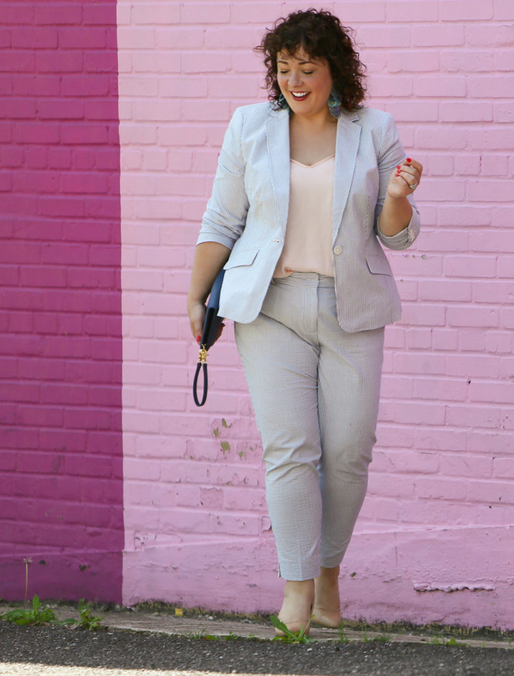 Wardrobe Oxygen in a seersucker pantsuit with blush J. Crew camisole, nude pumps from Nine West, and the Dagne Dover Essentials Clutch Wallet