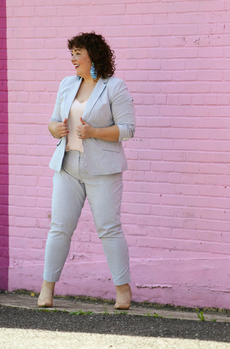 Wardrobe Oxygen in a seersucker pantsuit with blush J. Crew camisole, nude pumps from Nine West, and the Dagne Dover Essentials Clutch Wallet