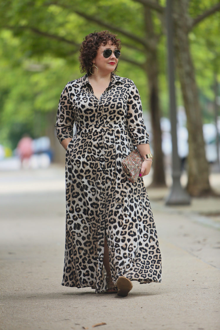 image of Alison wearing a leopard print maxi dress and aviator sunglasses