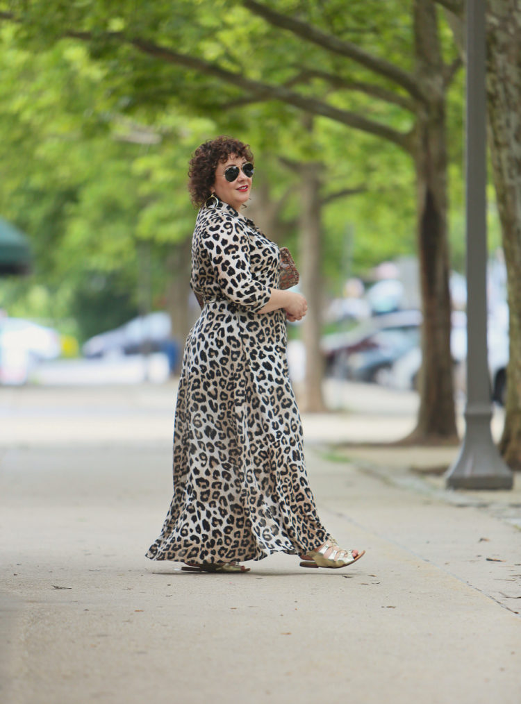 image of Alison wearing a leopard print maxi dress and aviator sunglasses